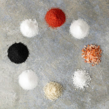 Eight different types of salt commonly used in cooking.