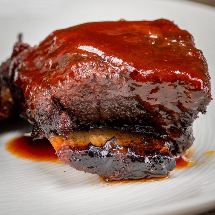 Beef short ribs with BBQ sauce.