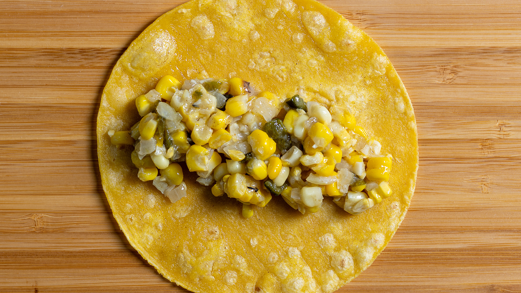 Add ⅓ cup of filling to a lightly fried tortilla.