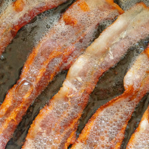 Homemade Applewood Smoked Bacon in a Cast Iron Skillet