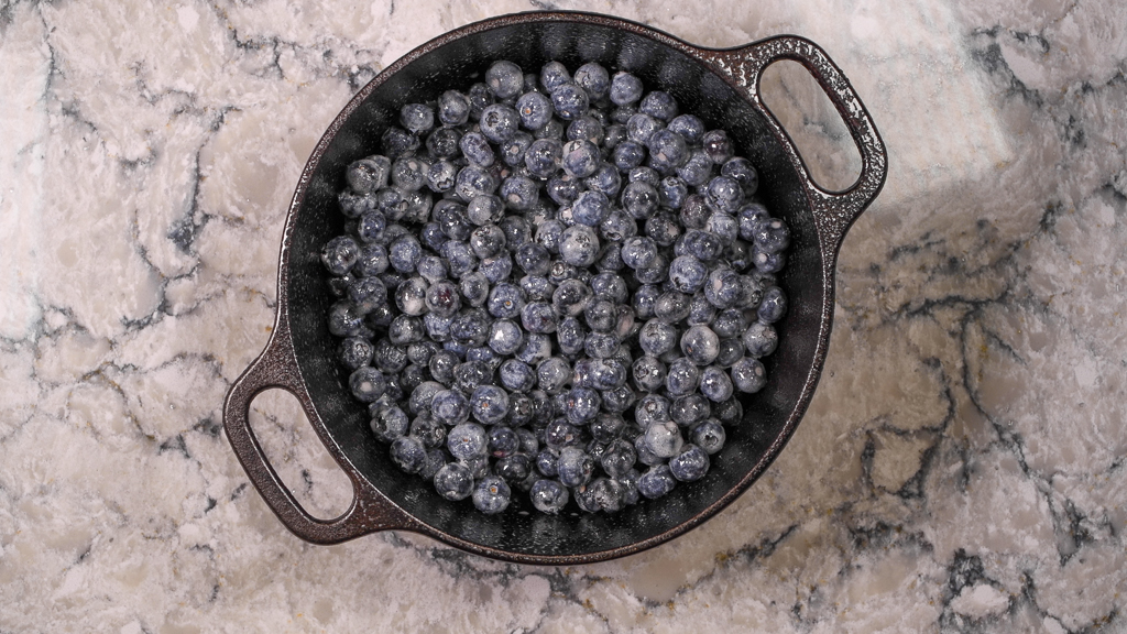 Blueberry Crisp Filling in a Cast Iron Skillet