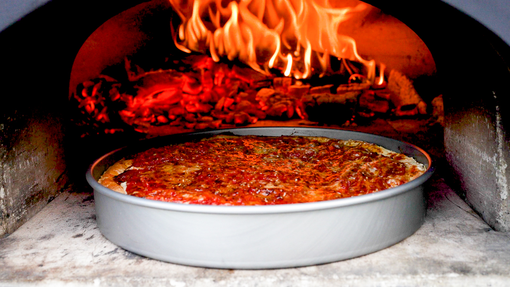 Chicago Pizza Cooking in Wood Fired Oven