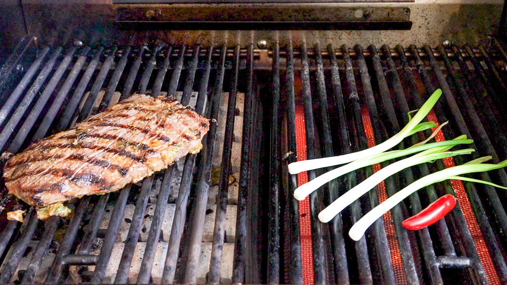 Flank Steak on Grill With Onions and Peppers