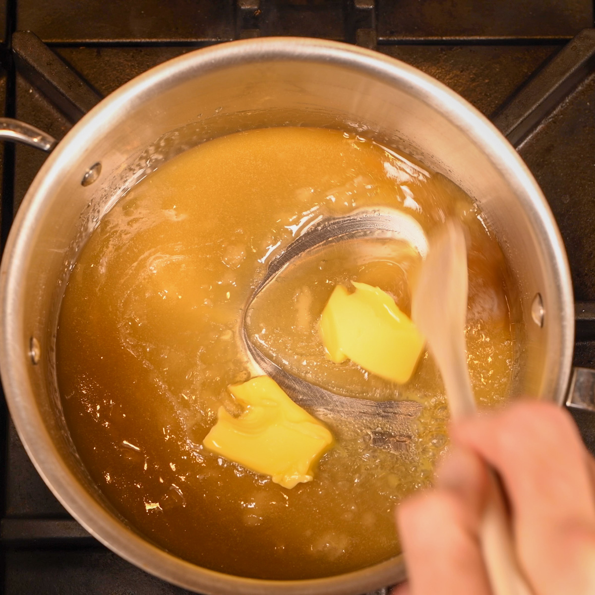 Add butter to the melted sugar.