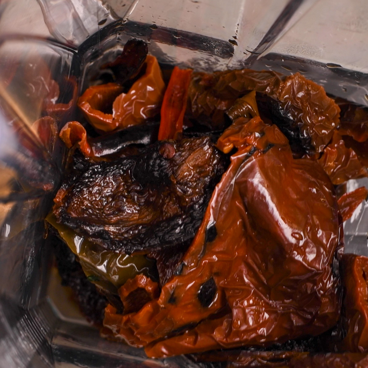 Add the soaked chiles to a blender.