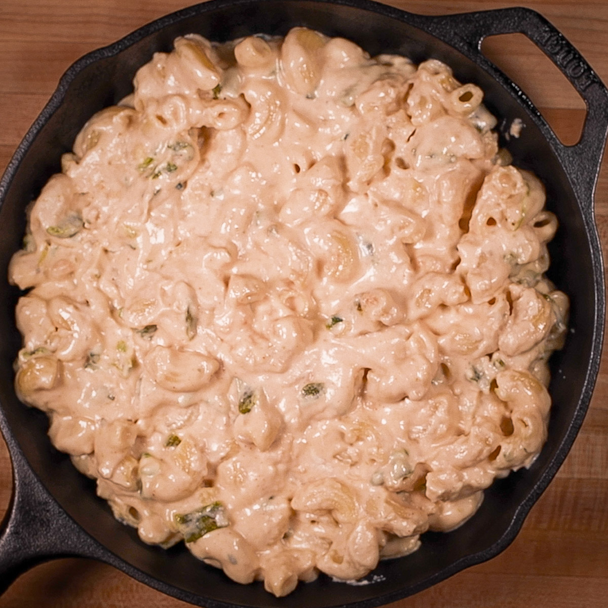 Transfer mac and cheese to a cast iron skillet.