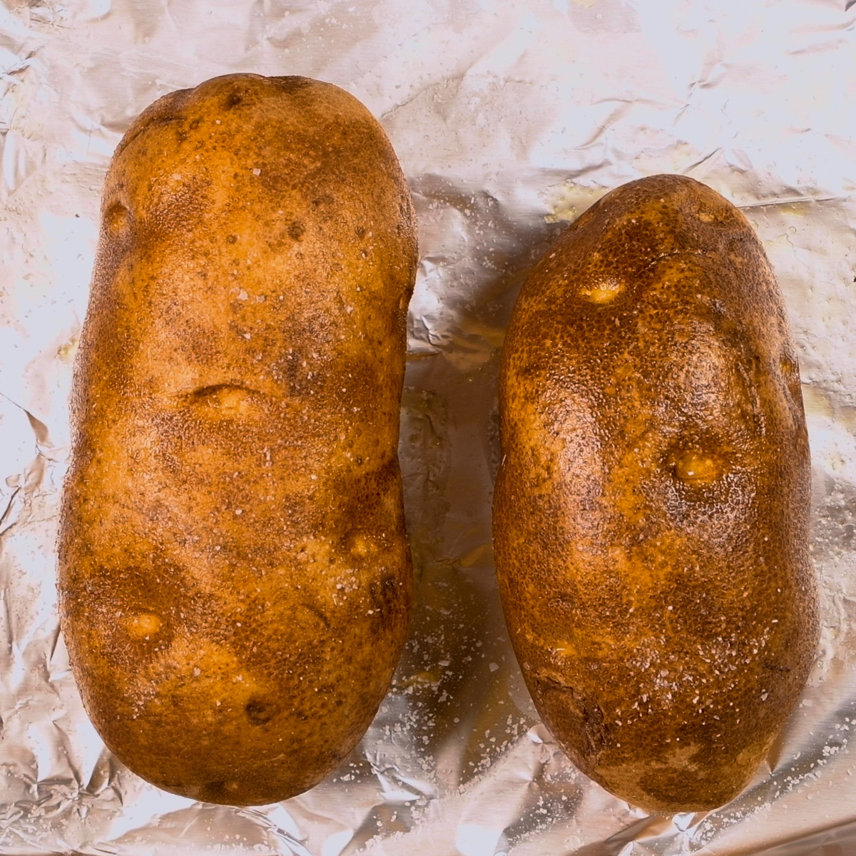 Bake the potatoes in the oven.
