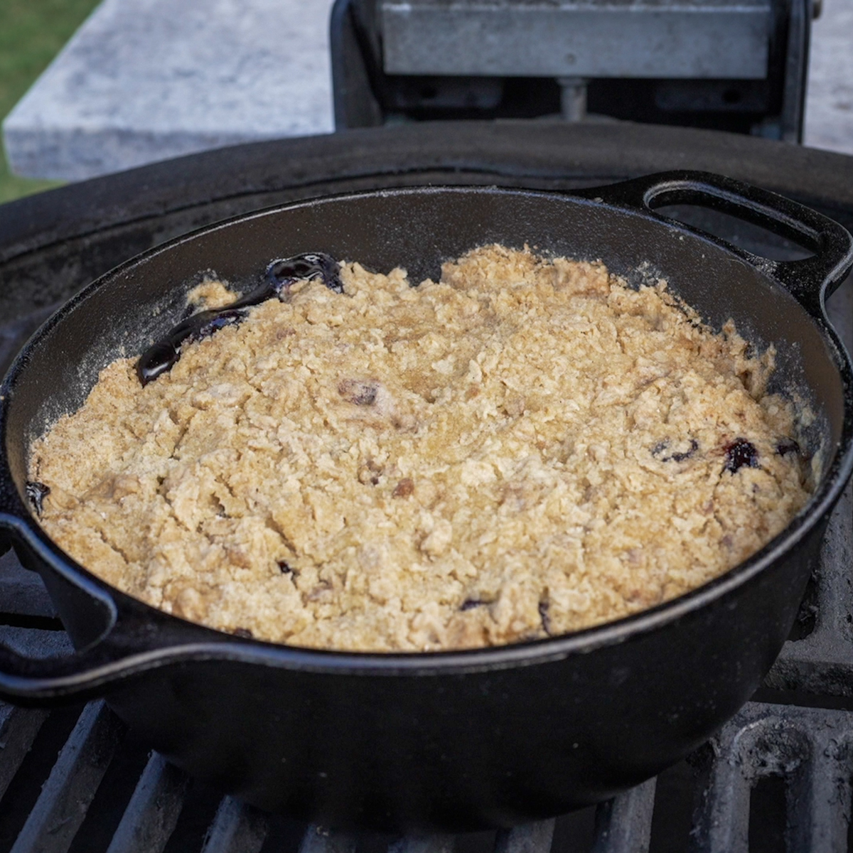 Place the blueberry crisp inside your smoker over indirect heat.