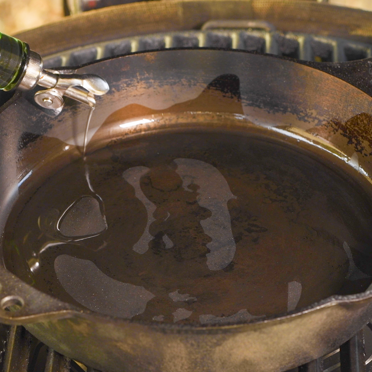 Add oil to the cast-iron skillet.