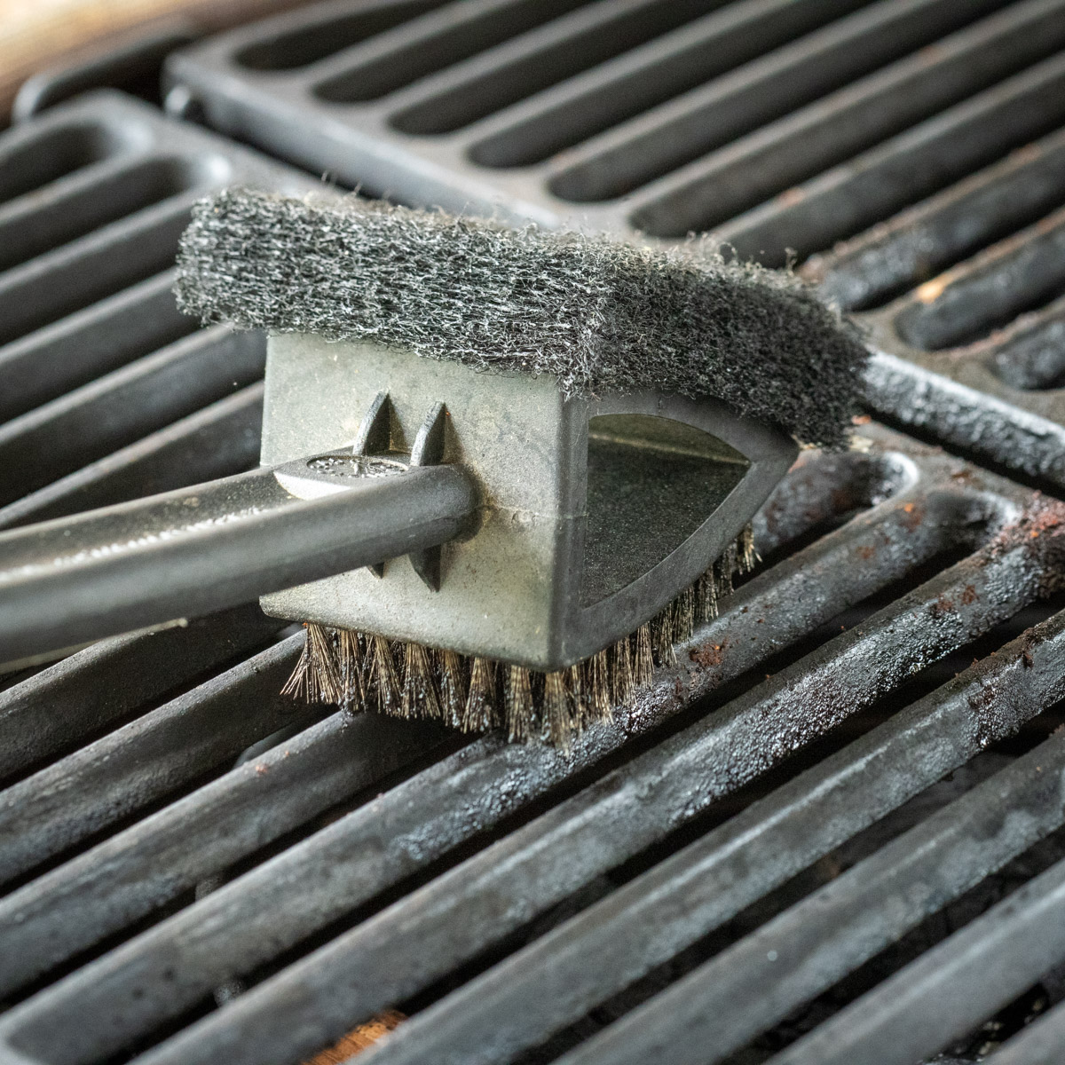 Cleaning a BBQ grill.