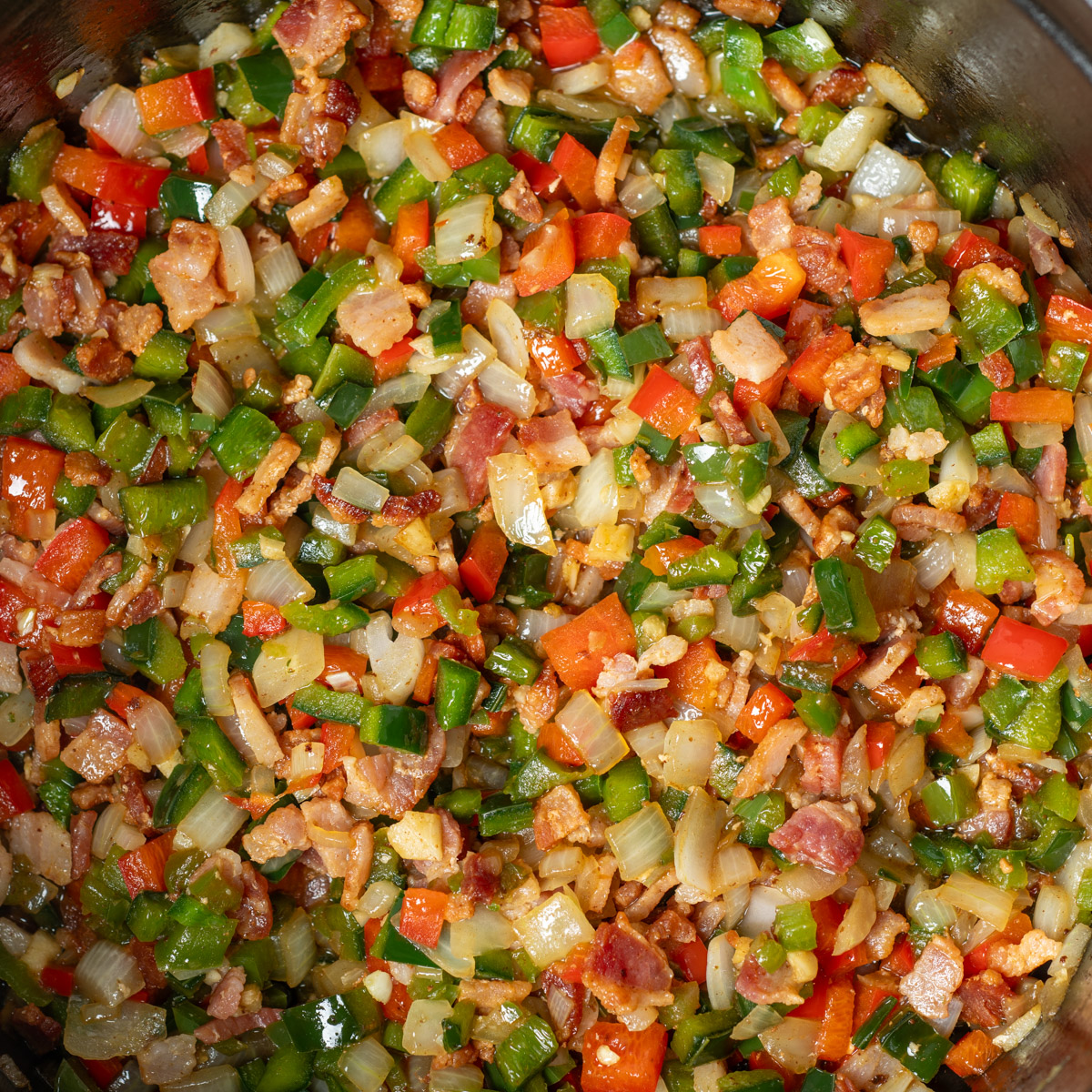 Cooked bacon and vegetables.