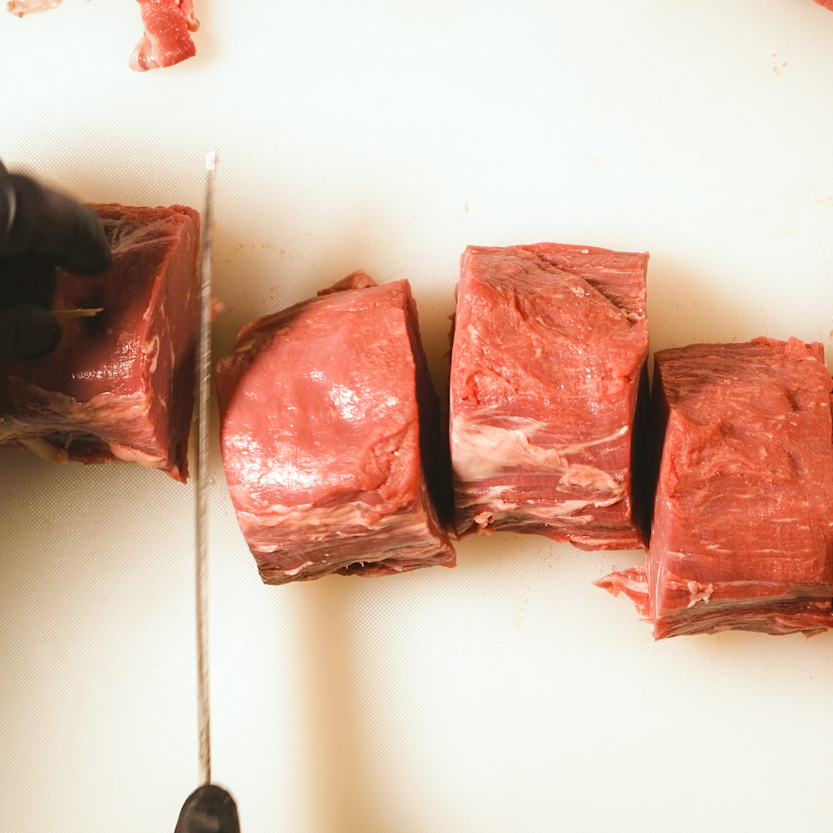 Cut the tenderloin into thick steaks.