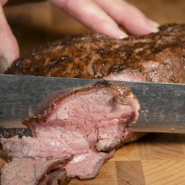 Cutting steak across the grain.