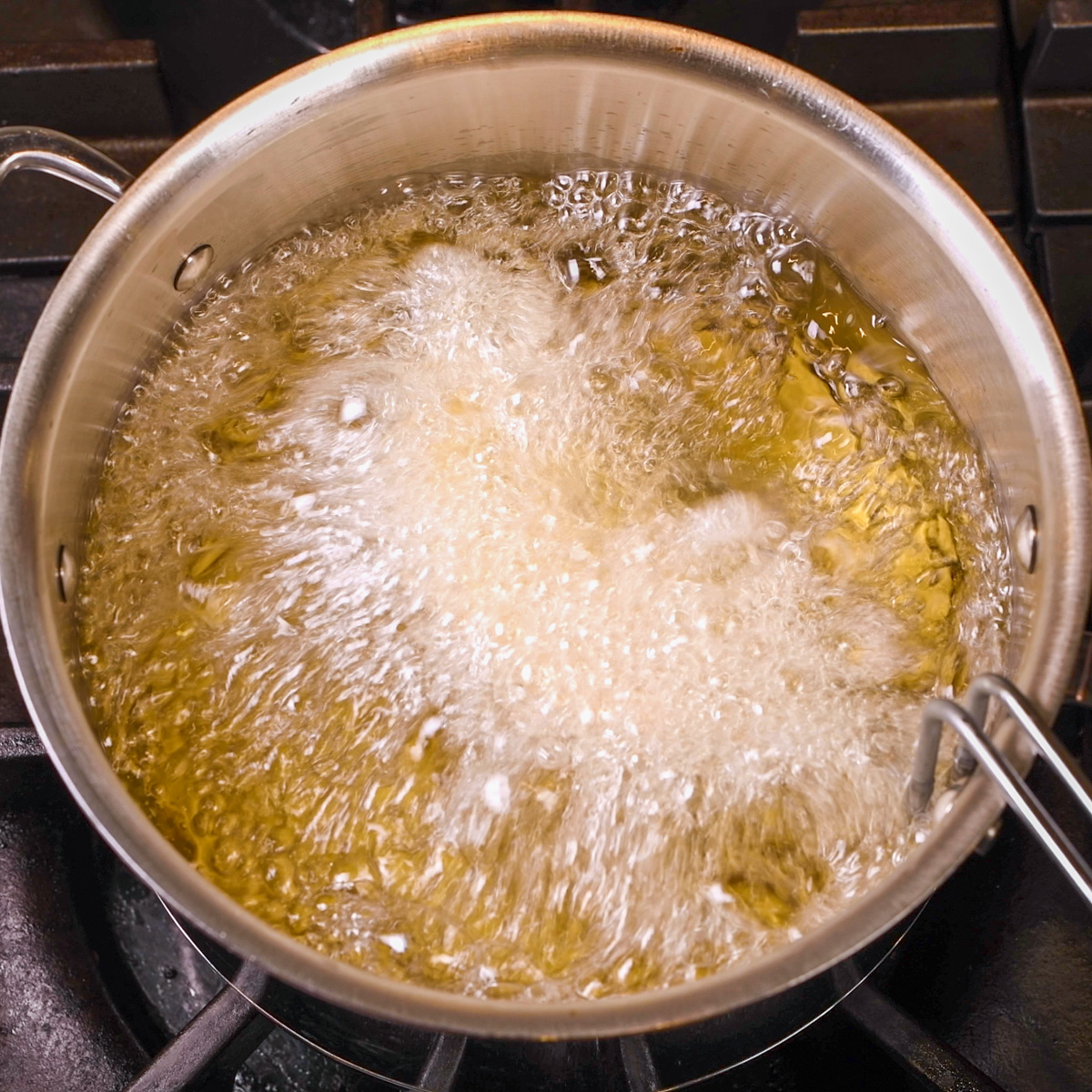 Deep fry taco shells in hot oil.