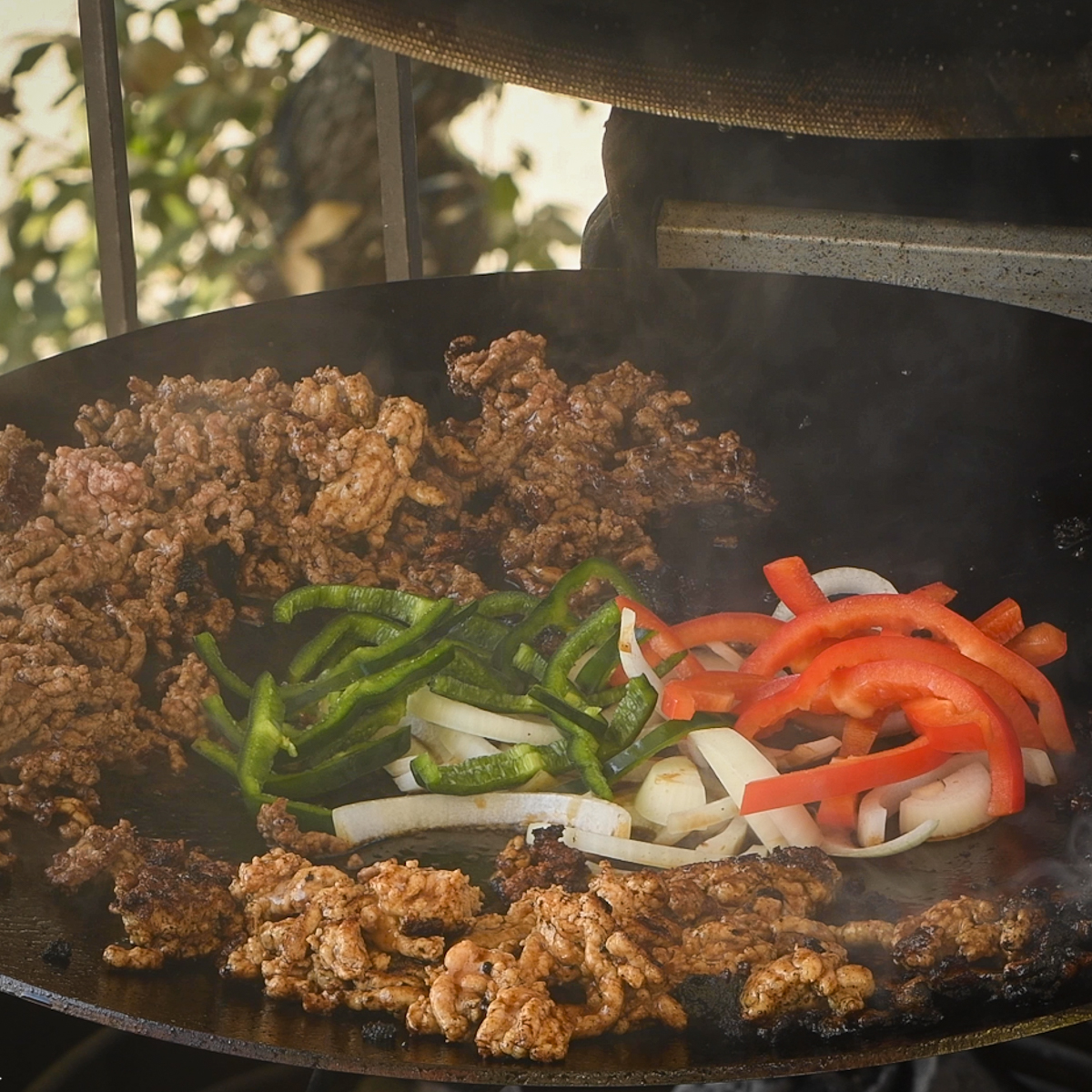 Vegetables cooking on a discada