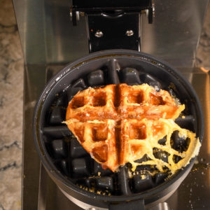 Grilled cheese sandwich cooked in a waffle maker.