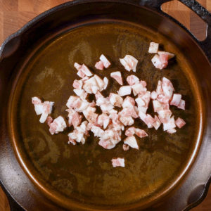 Guanciale in a cast iron skillet.