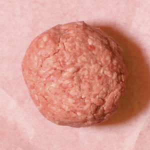 Half pound ball of freshly ground meat shaped into a ball.