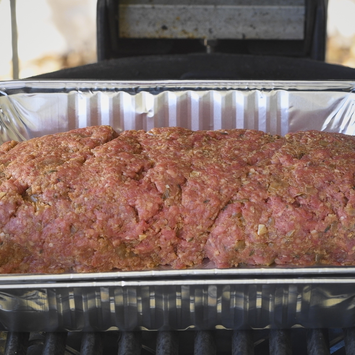 Place the meatloaf in the smoker.