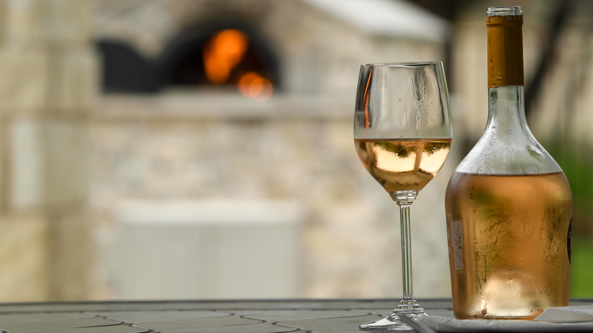 Enjoy a Glass of Wine While the Wood-Fired Oven Warms Up.