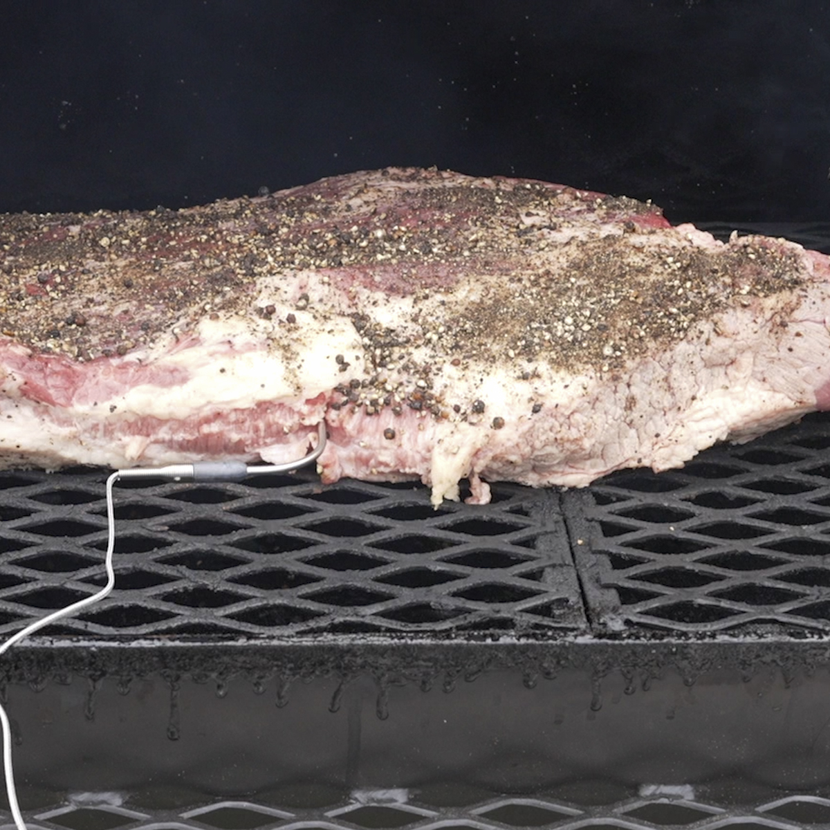 Place the brisket directly on the grill grate.