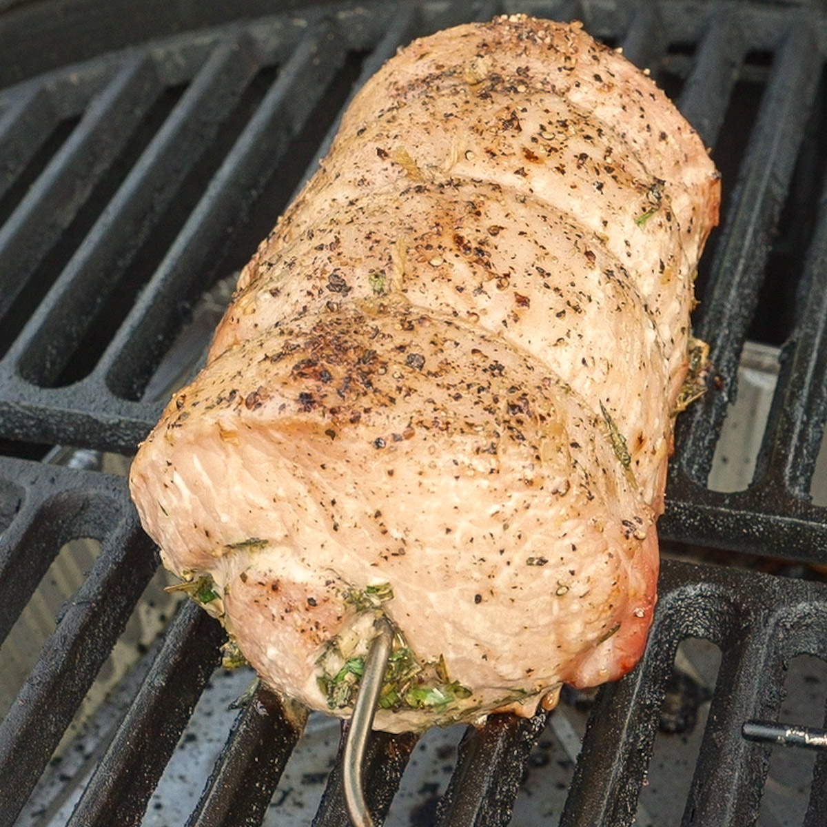 Place the tied pork loin in the smoker.