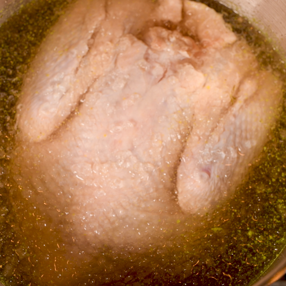 Place the turkey in the brine.