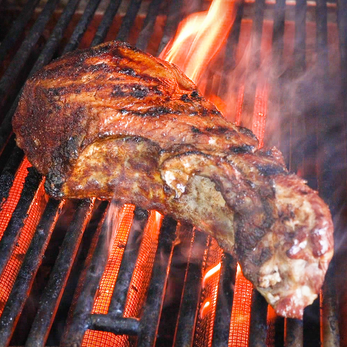 Sear the pork chops on a hot grill.