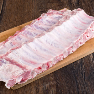 Remove the tough membrane from the back of the ribs.