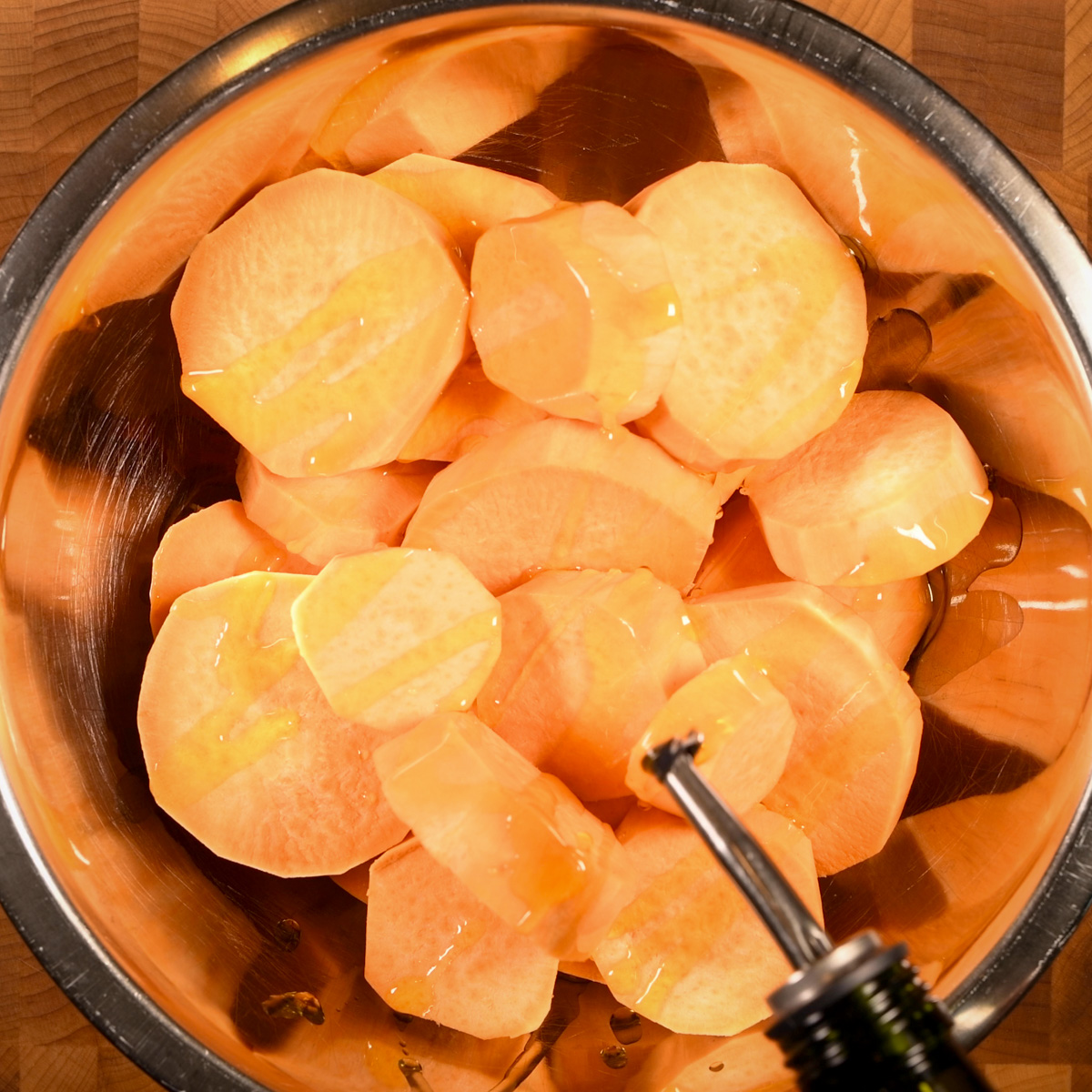 Coat the sweet potatoes with vegetable oil.