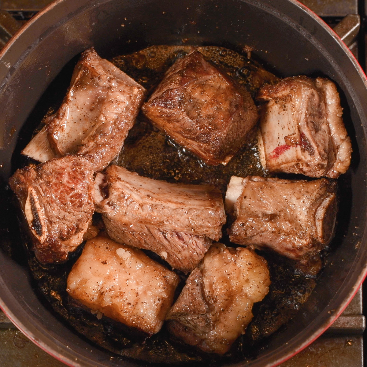 Sear the short ribs in a Dutch oven.