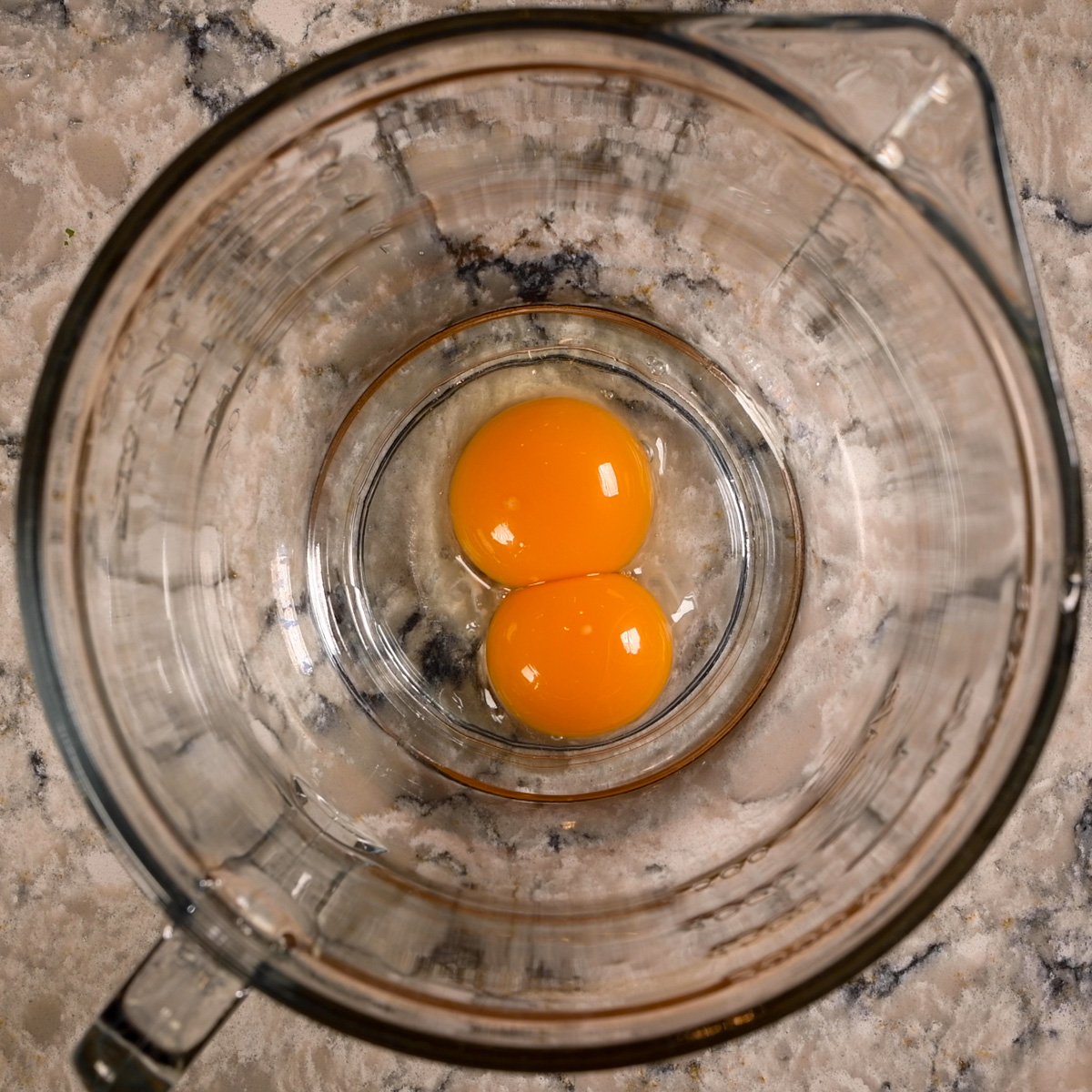 Separate eggs and gently beat egg yolks.