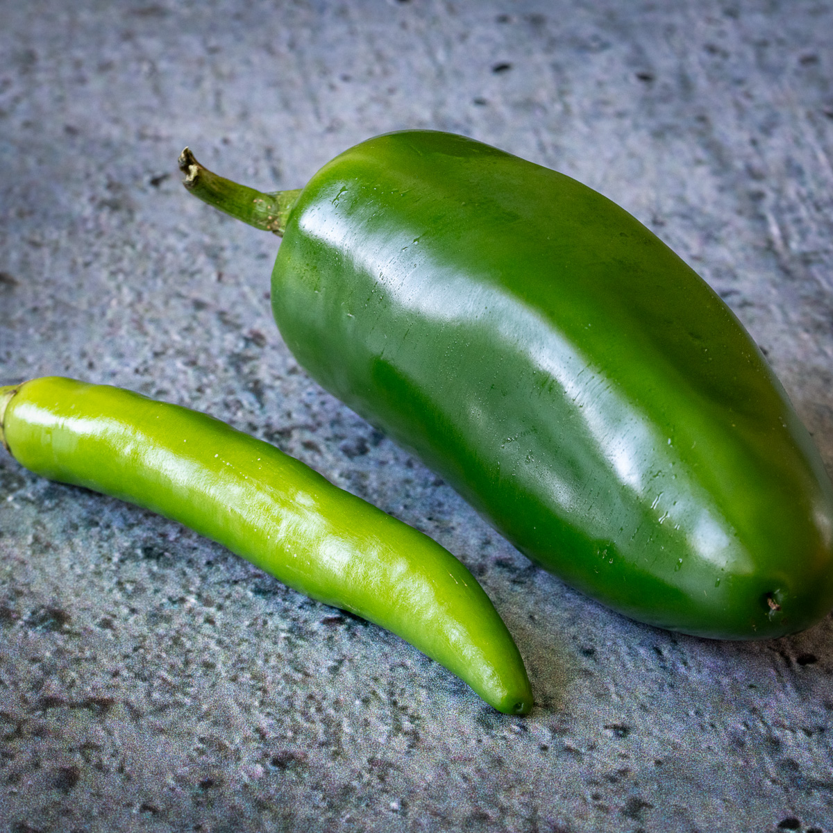 Serrano and jalapeño peppers.
