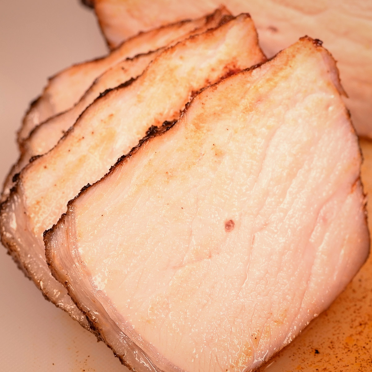 Sliced cooked pork chop.