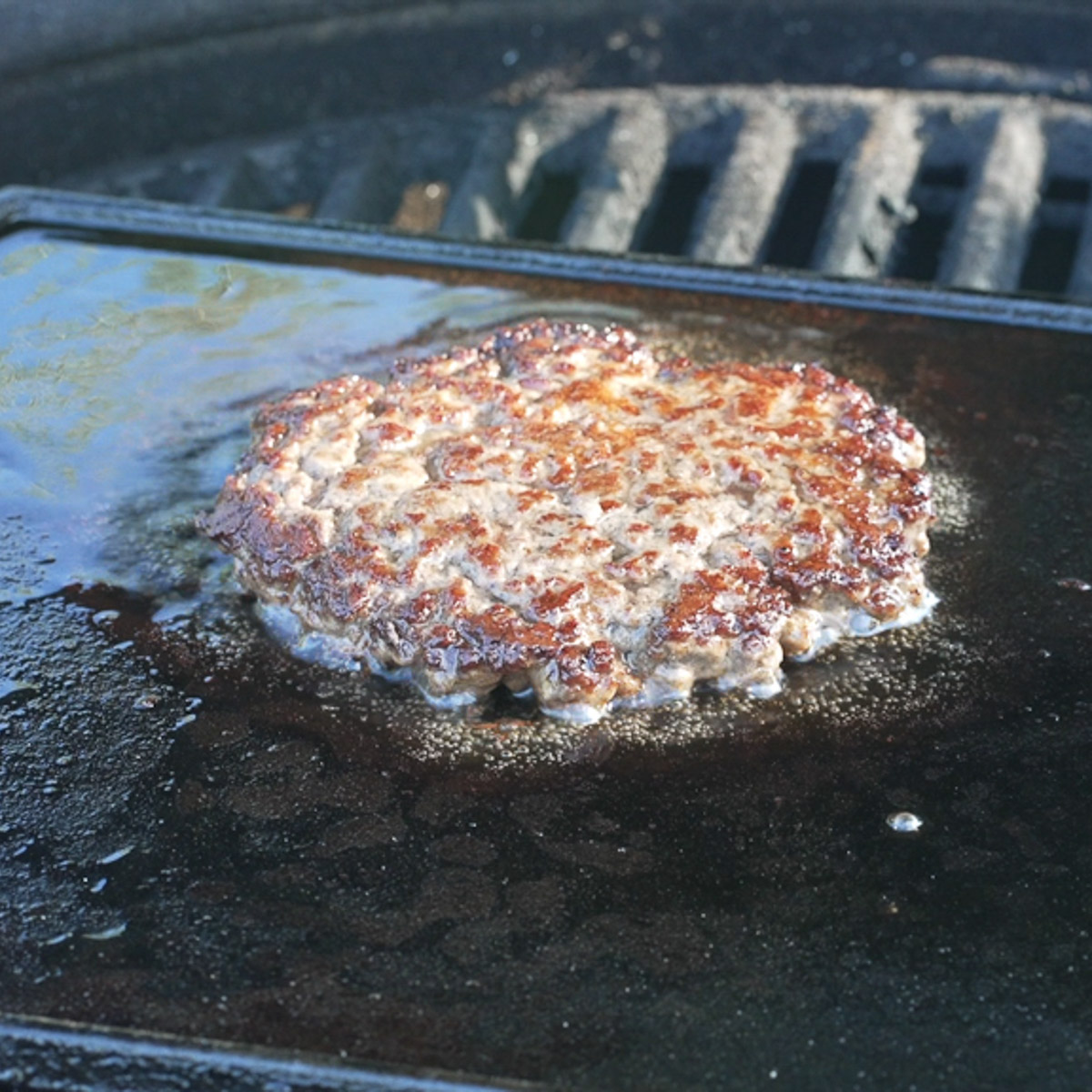 Smash burger on a hot griddle.