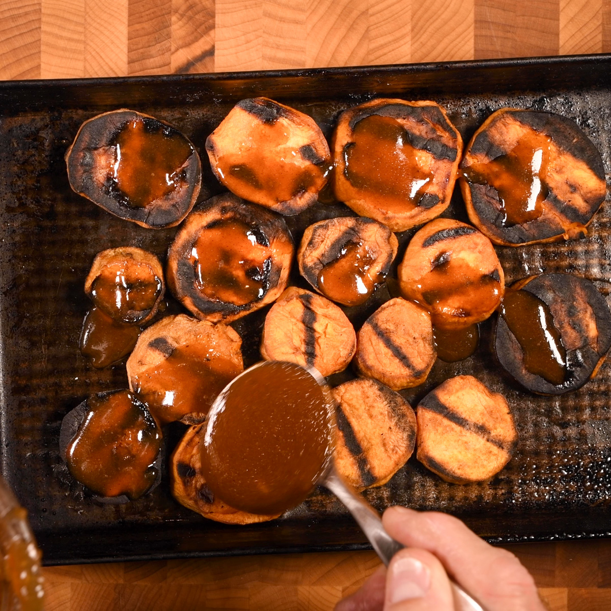 Spoon the glaze over the grilled sweet potatoes.