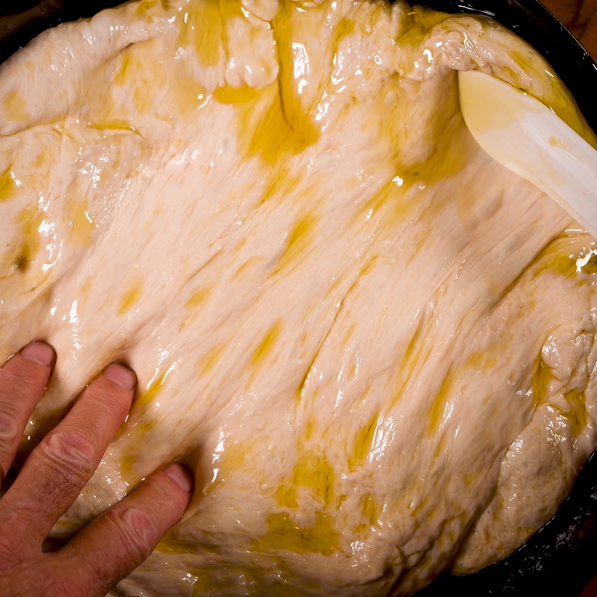 Spread the dough in the skillet.