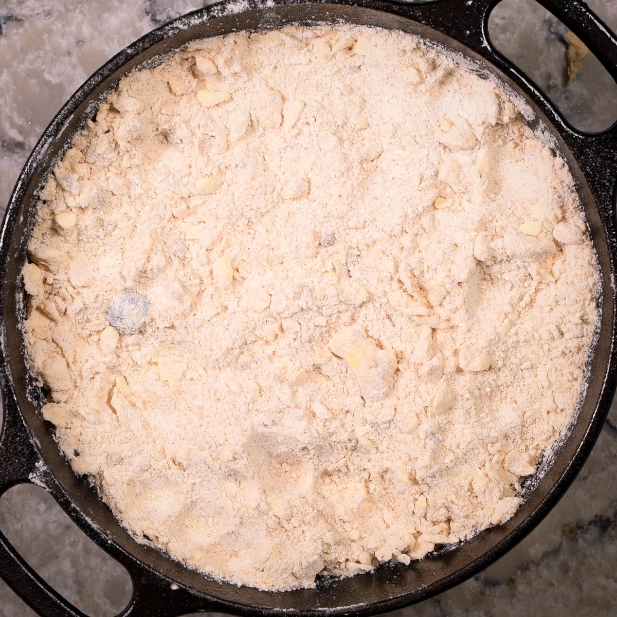 Spread the topping over the blueberries.