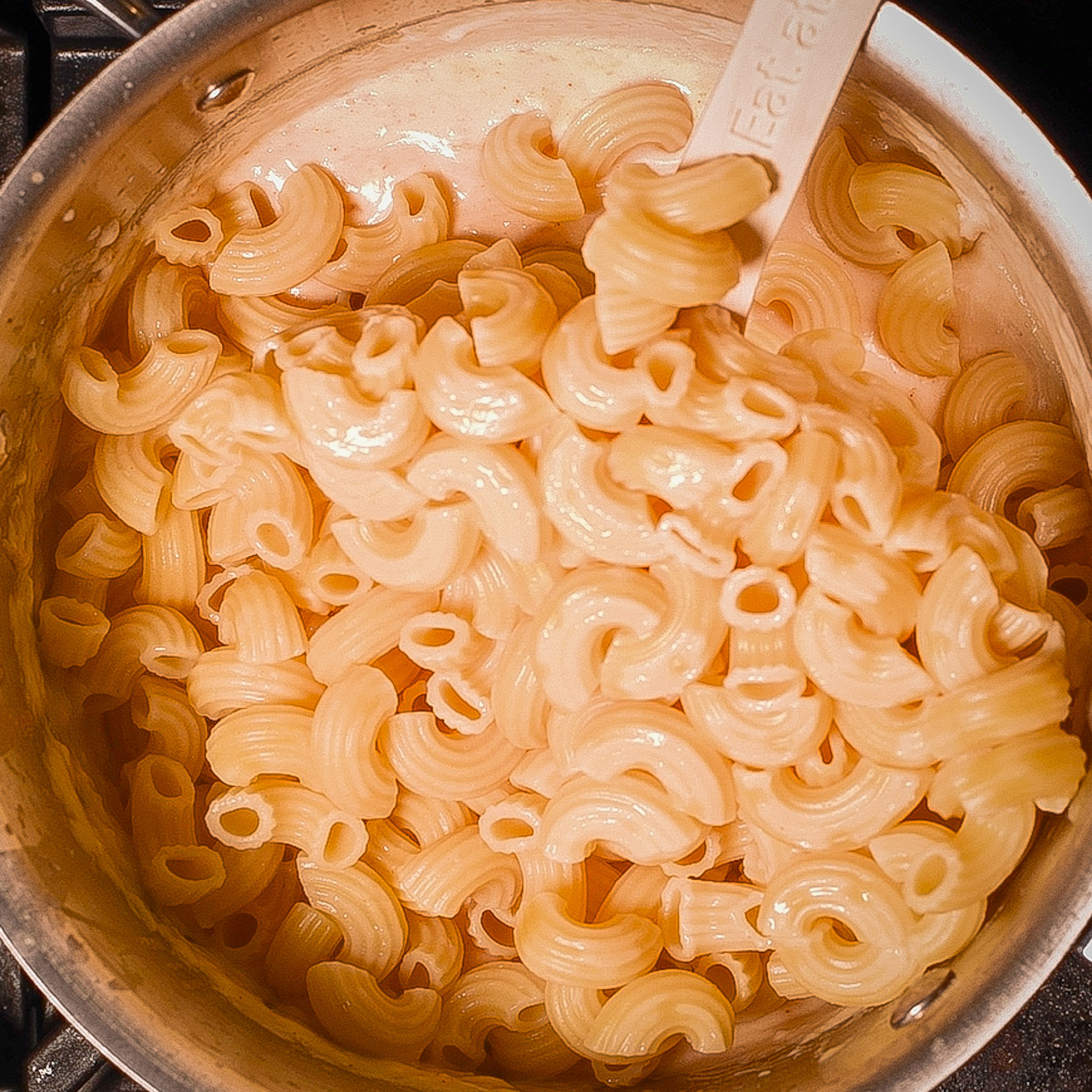 Add the cooked elbow macaroni.