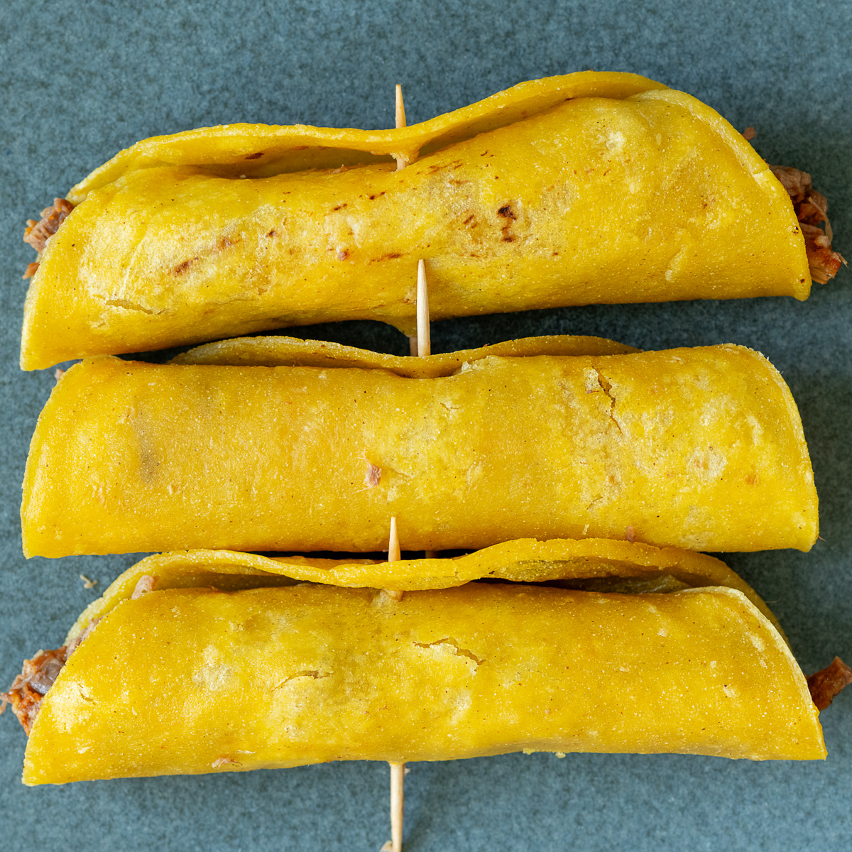 Place a toothpick through the center to hold the taquitos closed.