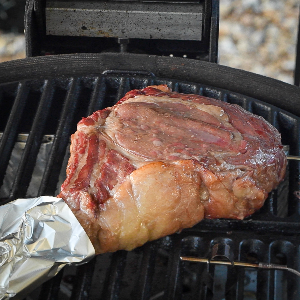 Tomahawk steak on grill.