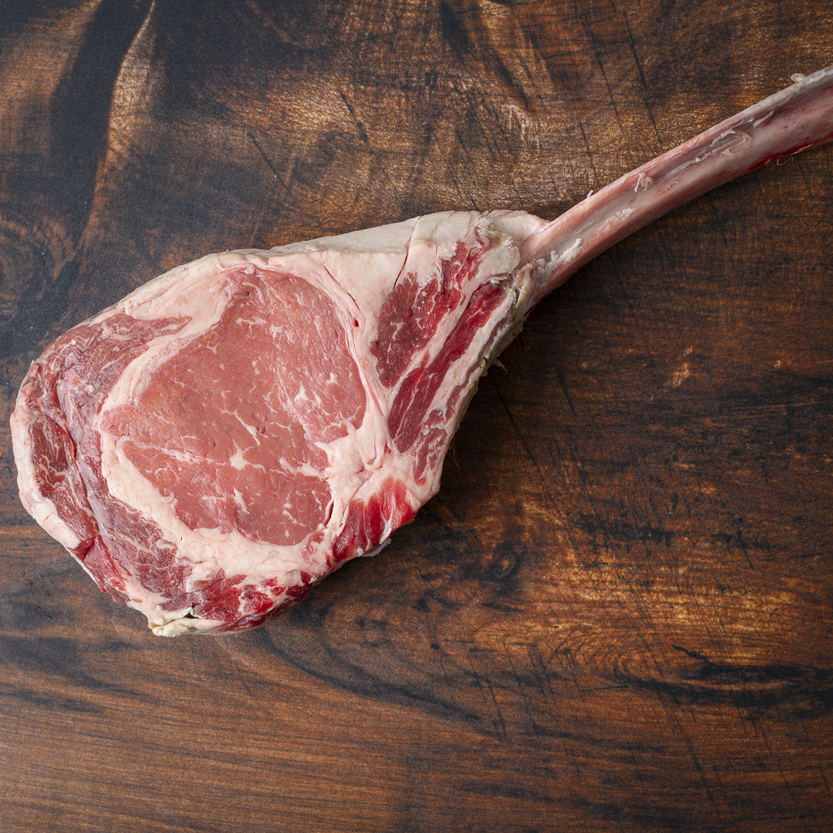 Raw tomahawk steak.