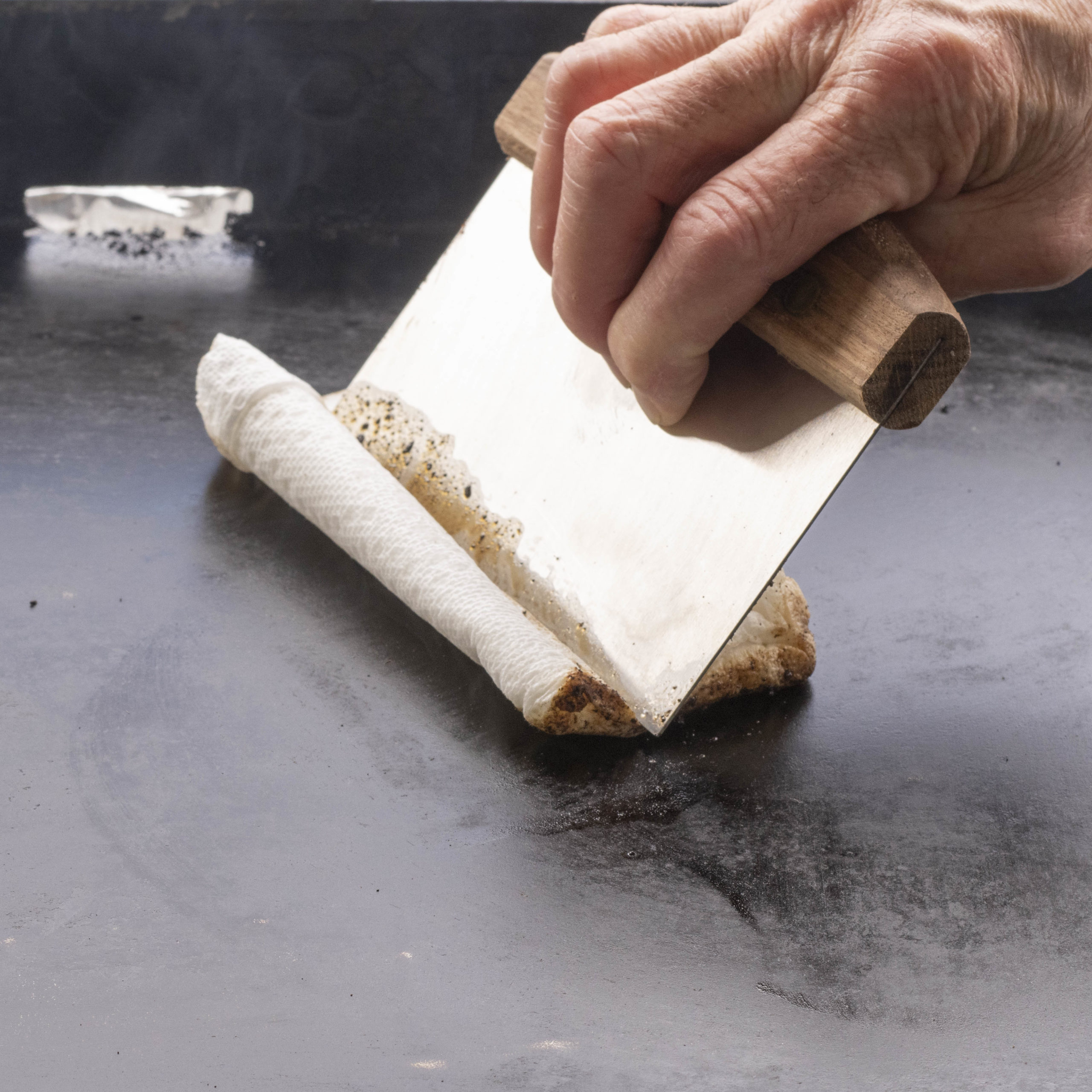 Wipe down the griddle with wet paper towels.